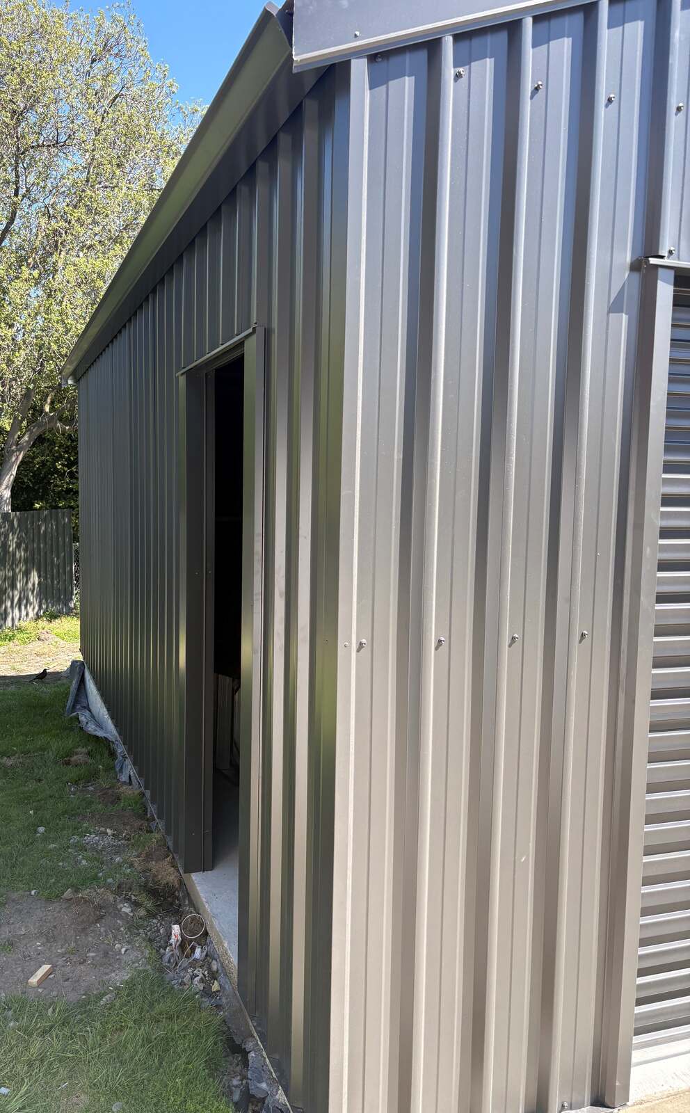 Side of the garage with the personal access door